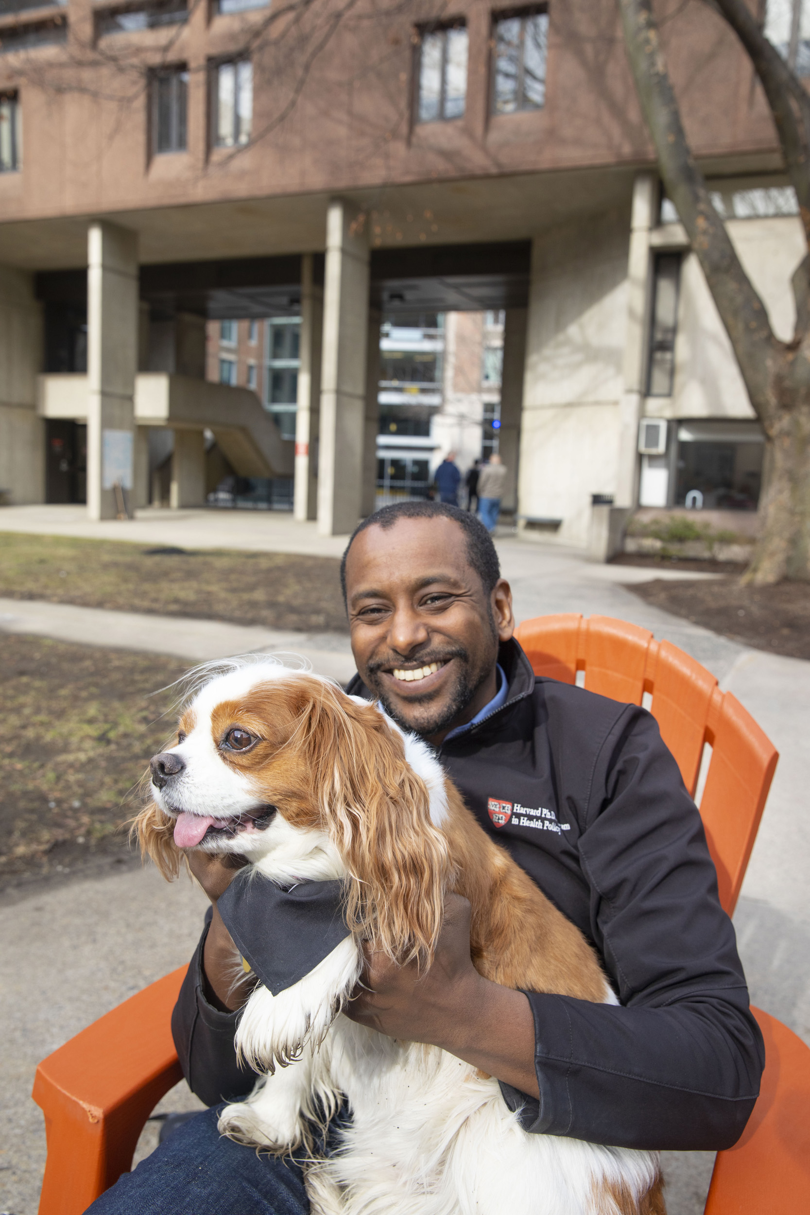 Anas El Turabi holds his dog Corgi outside Mather House.