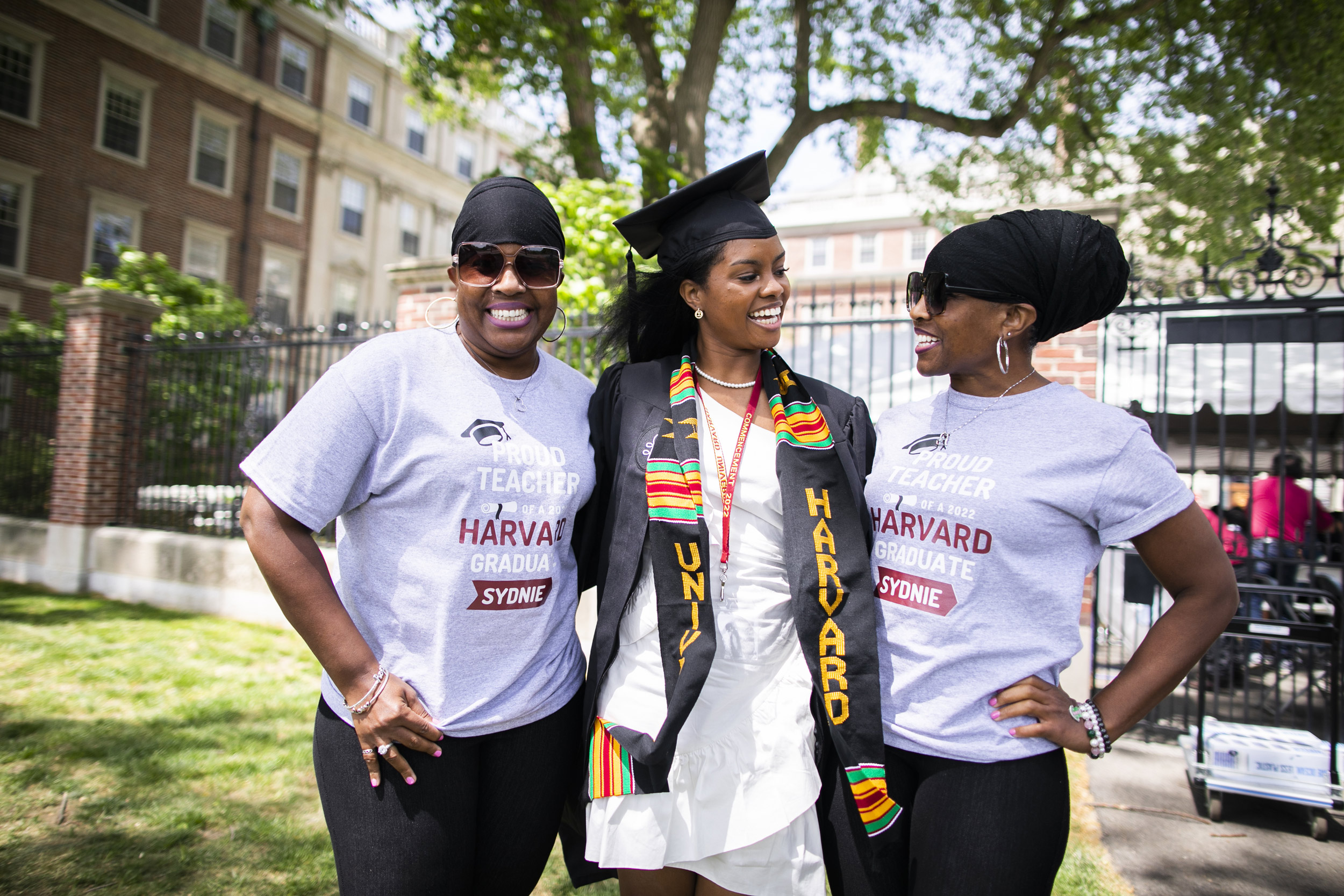 Sidney Cobb ’22 (center), of Winthrop House, is pictured with her childhood teachers Aprile (left) and Deanna Thomas.