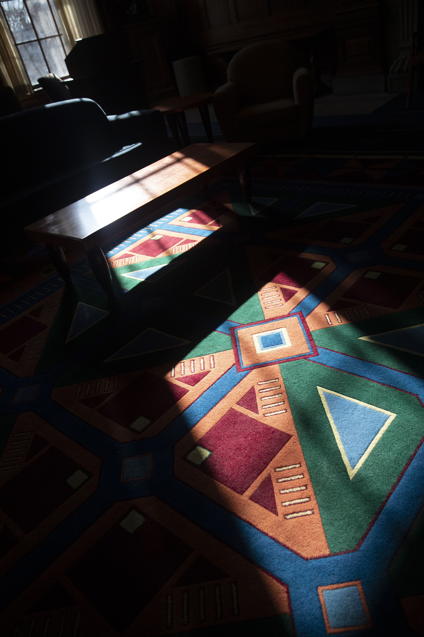 Thompson room rugs have a colorful abstract pattern in the Barker Center.