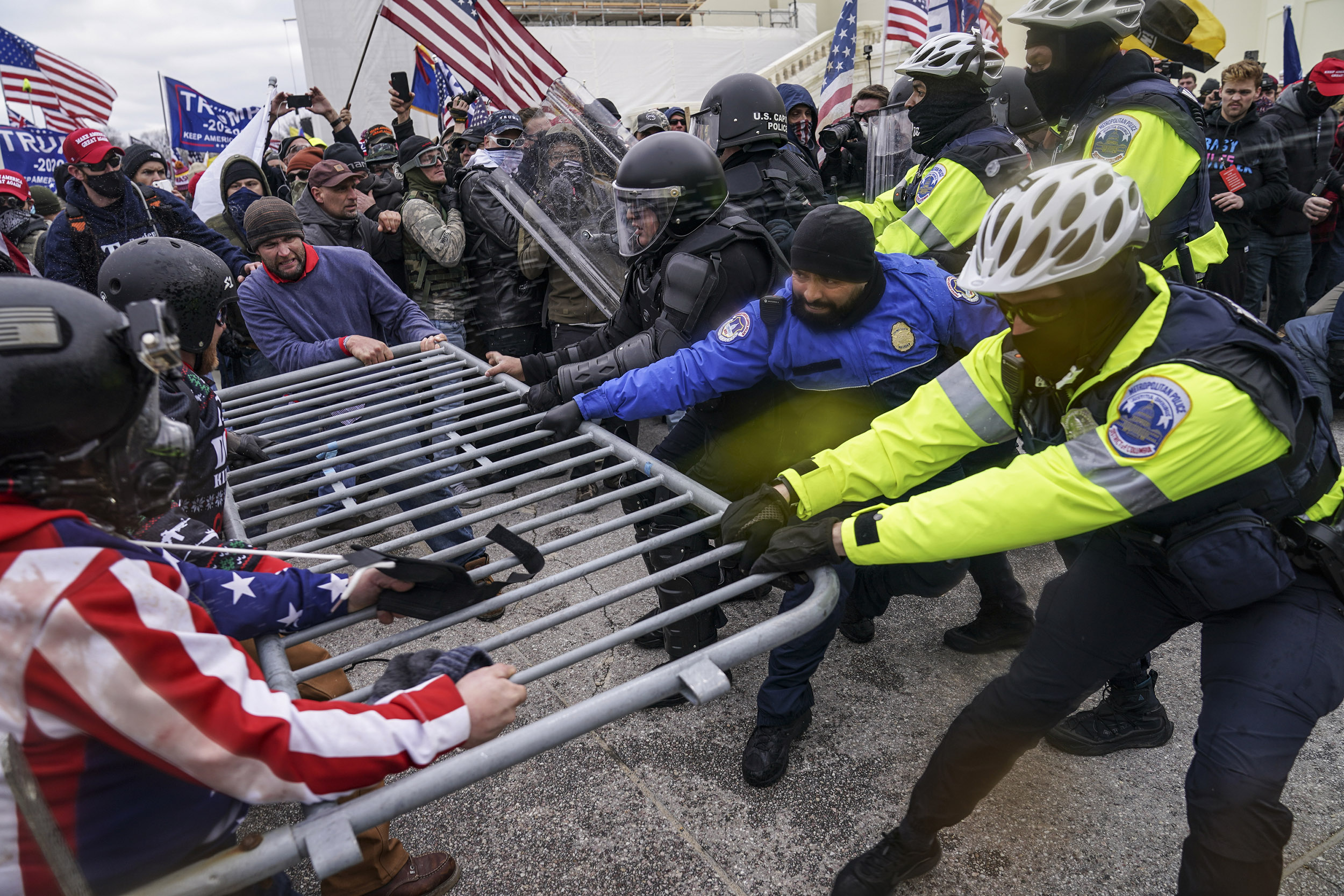 People try to break through barrier at Capitol on Jan. 6, 2021.