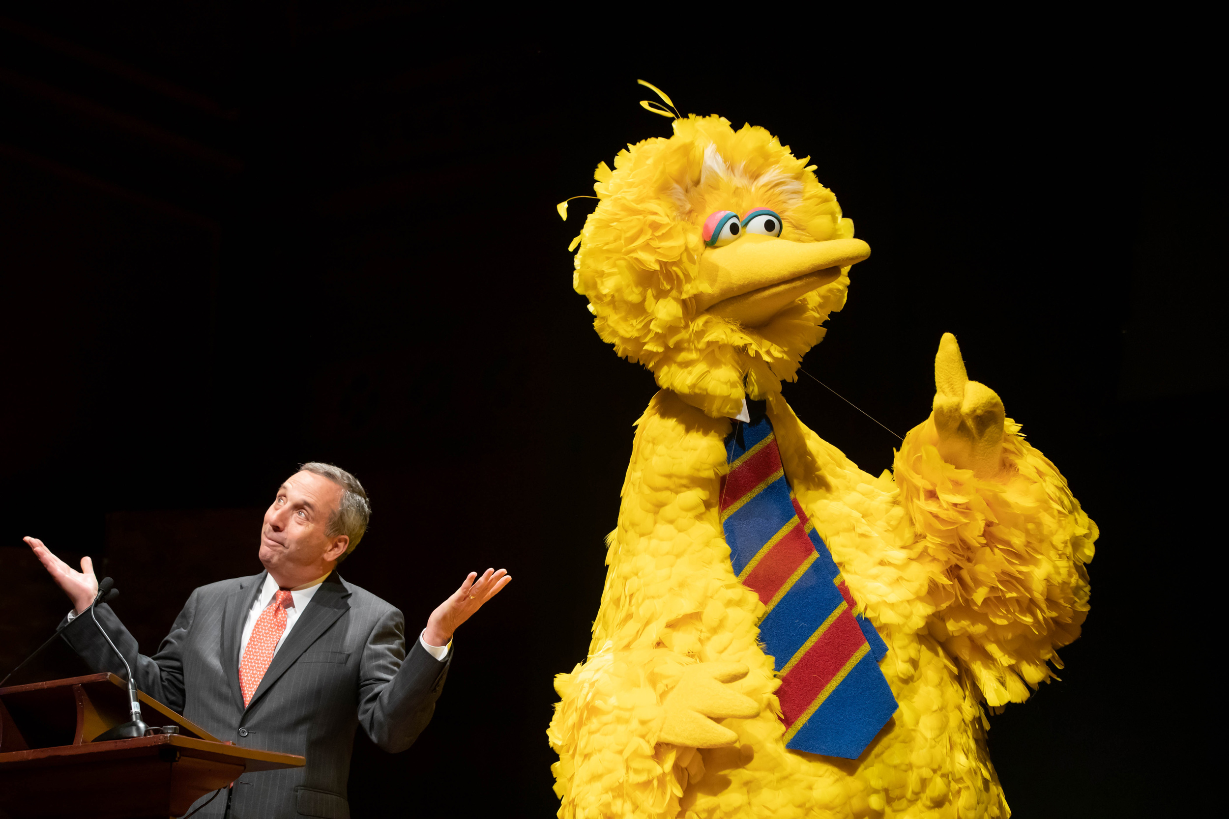 Big Bird and Bacow shared the stage at an October 2019 event marking the 50-year anniversary of Sesame Street and the Harvard partnership that helped create it.