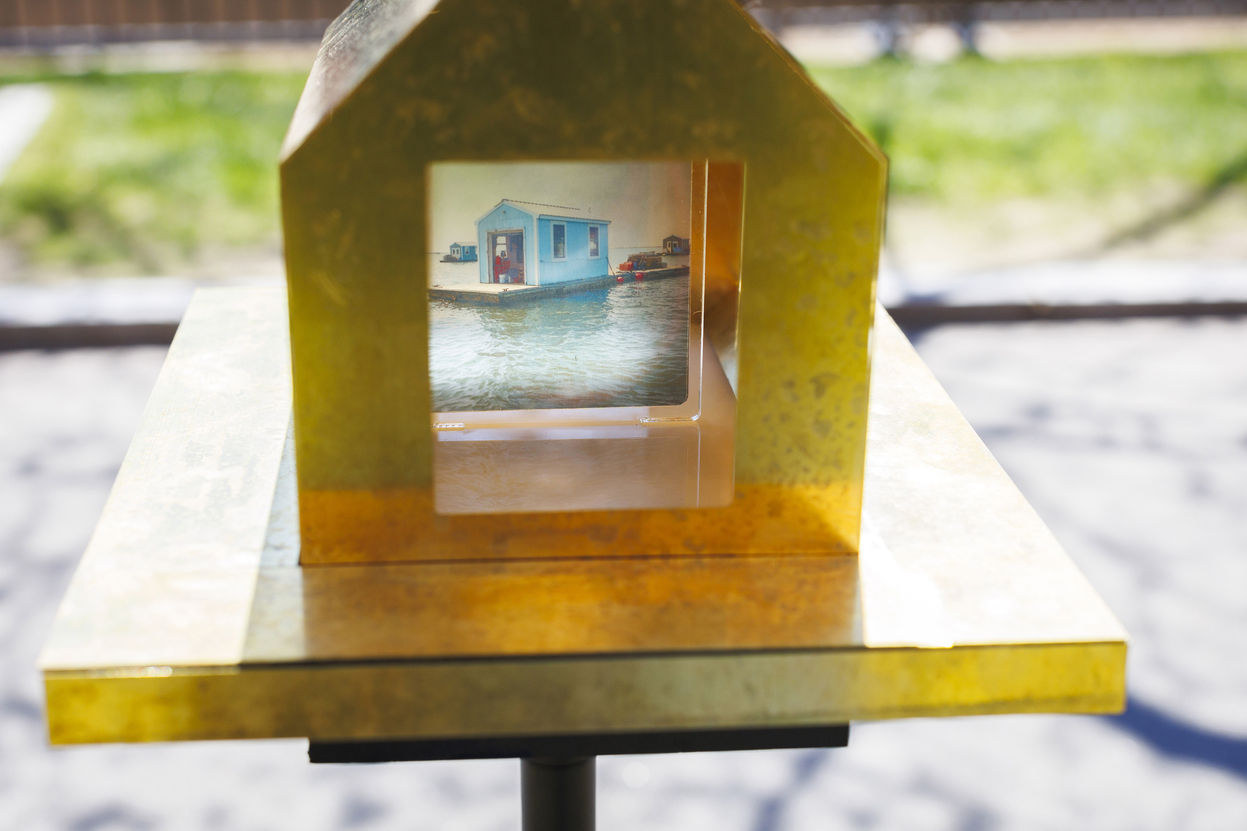 A detail image of a public art installation called “Oyster Floats, Camera Obscuras for a Floating City” by Randy Crandon GSD ’25 and Dylan Herrmann-Holt GSD ’25 is pictured alongside Memorial Hall.