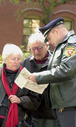 Charles Marren helps tourists in Harvard