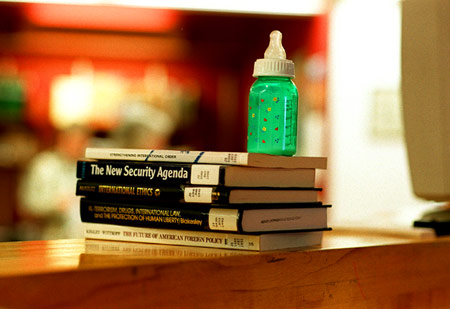 Baby bottle and books