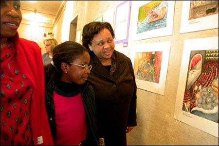 Schoolchildren viewing their peers' art on the walls of the Fogg