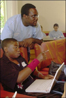Rindge & Latin student Buchi Ogbo with mentor Peter Asante '07