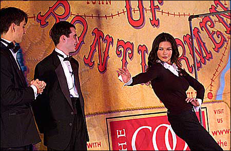 Zeta-Jones gestures forbiddingly toward her Hasty