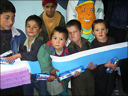 Children perform with giant