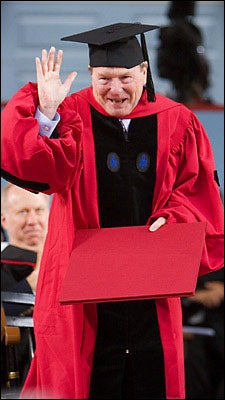 Lehrer holding his diploma