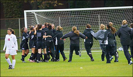 Winning team crowd the