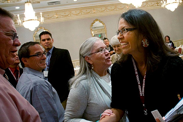 Jodi Archambault Gillette, deputy associate director of intergovernmental affairs in the Obama administration (right), meets with attendees after her talk. American Indians have a voice in the White House and the attention of the new president, she told the group.