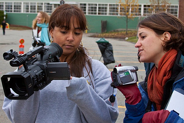 Student Sarah Ahmedi (left) films a short sequence as Briget Ganske, a student at Harvard Graduate School of Education, assists.