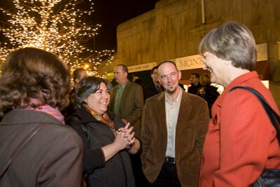 Cambridge Historical Society President Jinny Nathan (second from left) and its  executive director, Gavin Kleespies (center), chat with Harvard President Drew Faust during the "Think Harvard Square" festivities.