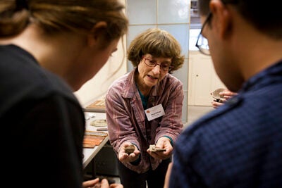 Longtime director Nancy Selvage (center) is the driving force behind the program and its integrated curriculum that taps into art and scholarship across the University and around the world. Here she introduces undergraduates to ceramics.