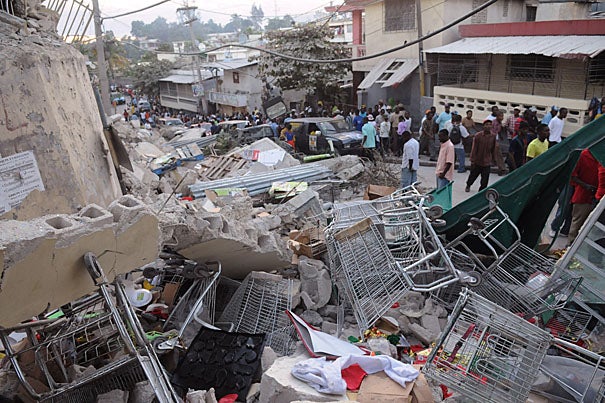 Harvard is extending medical and humanitarian aid to Haiti, which experienced a 7.0-magnitude earthquake, the largest ever recorded in the area, on Tuesday (Jan. 12). Debris from a collapsed building covers Delmas Road, a major thoroughfare, in Port-au-Prince.