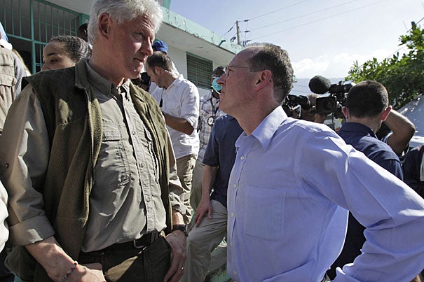 Former president and U.N. special envoy for Haiti Bill Clinton (left) talks to Paul Farmer while touring the General Hospital in Port-au-Prince Monday (Jan. 18). Partners In Health (PIH), a not-for-profit Harvard affiliate co-founded by Farmer, has taken the lead in University-related medical aid.