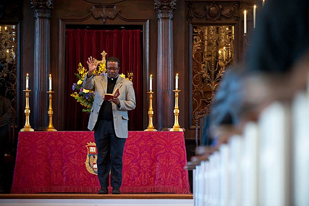 The Rev. Gabriel Michel leads the benediction to close a memorial service for the victims of the Haiti earthquake at the Memorial Church.