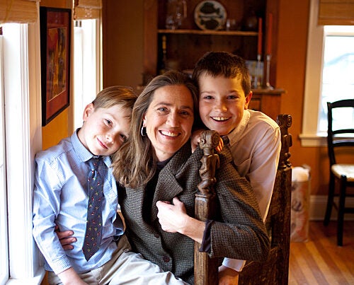 Harvard history professor Caroline Elkins balances her intense academic life with family life. Here she is with sons Jake, 7, and Andy, 9, in their Cambridge home. 