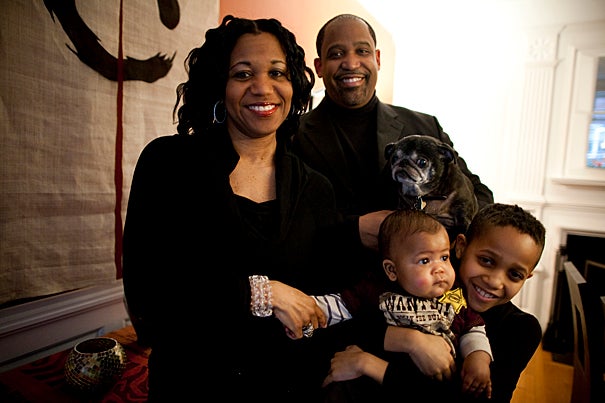 (Cambridge, MA - February 26, 2010) - Ronald Sullivan Jr. and Stephanie Robinson are master and co-master of Winthrop House. They live in the Winthrop House with their son Ronald Sullivan III, or Trey, and their five month old baby Chase. (left to right) Stephanie, Ron, their dog Nietzsche, Chase, and Trey are pictured in their dining room. Staff Photo Stephanie Mitchell/Harvard University News Office