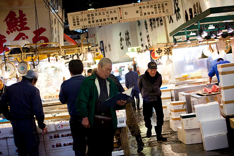 The fish market is a bustling place during the early morning hours.  Stephanie Mitchell/Harvard Staff Photographer