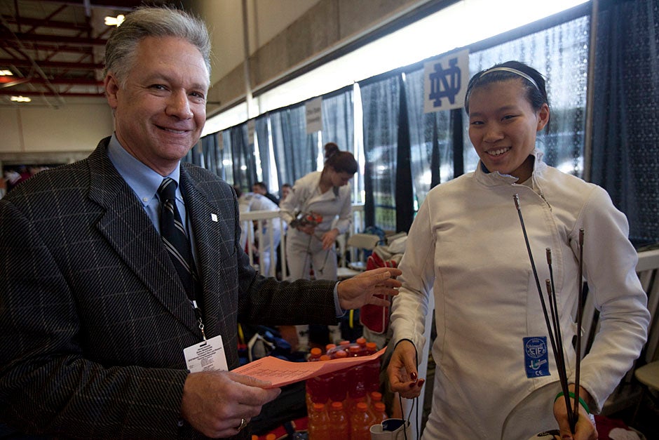 Coach Peter Brand and Felicia Sun '13 are all smiles at the NCAA Fencing Championships.  
Kris Snibbe/Harvard Staff Photographer