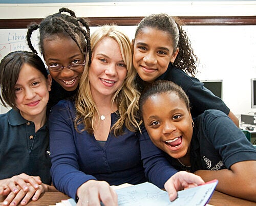 Kim Snodgrass: “I used my education as my savior. It was like my thing that I could always go back to, no matter what happened in my life.” Snodgrass is pictured with students she teaches at the Prospect Hill Academy in Somerville, Mass.