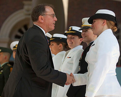 Michael G. Vickers, U.S. assistant secretary of defense for special operations, low-intensity conflict, and interdependent capabilities, congratulates Olivia Volkoff '10  during the ROTC commissioning ceremony.