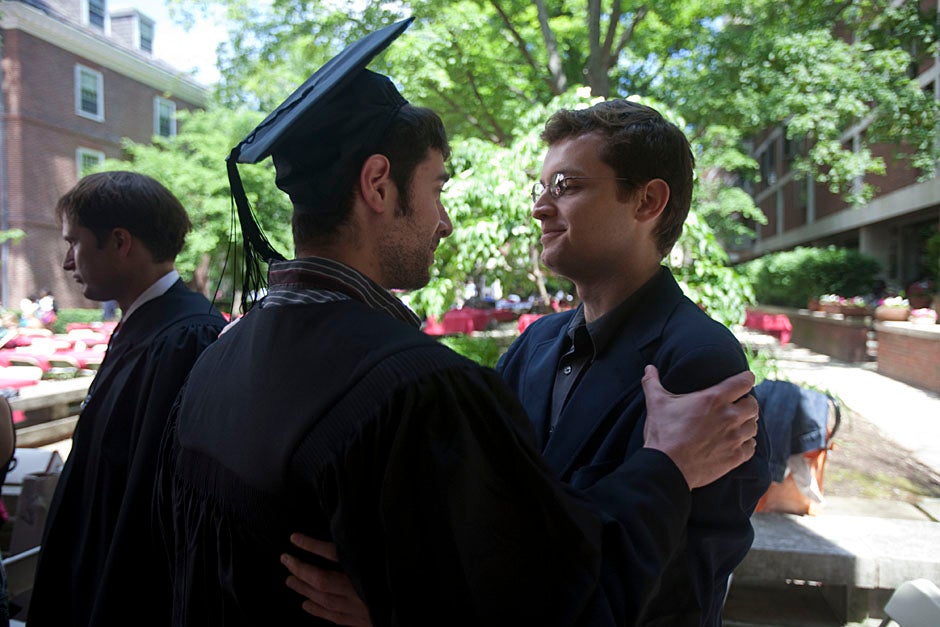 Quincy House resident David Rice '10 (left) is congratulated by Zachary Stone, research assistant in the School of Engineering and Applied Sciences. Kris Snibbe/Harvard Staff Photographer