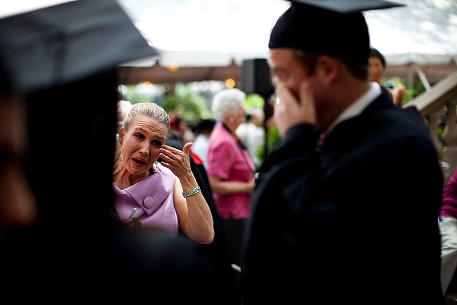 Shelly Mason (left) and her son, Russell Mason, the first Mason to graduate from college, both shed a tear after he receives his diploma at Winthrop House. Stephanie Mitchell/Harvard Staff Photographer