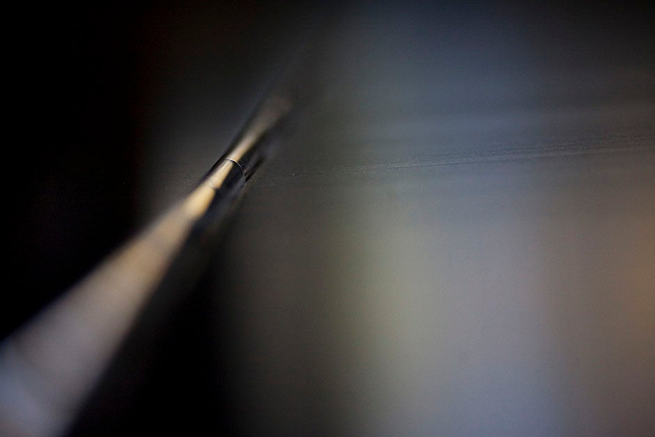 Focus converges on a piano hinge in the Music Building. Stephanie Mitchell/Harvard Staff Photographer