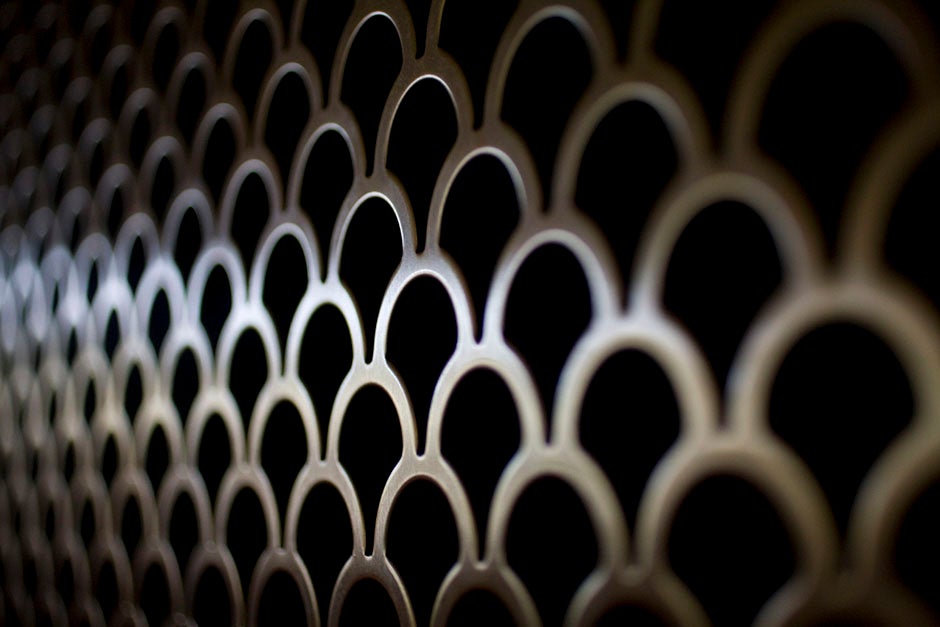 Repeating circles form a patterned grate inside the Ames Courtroom of Austin Hall. Stephanie Mitchell/Harvard Staff Photographer