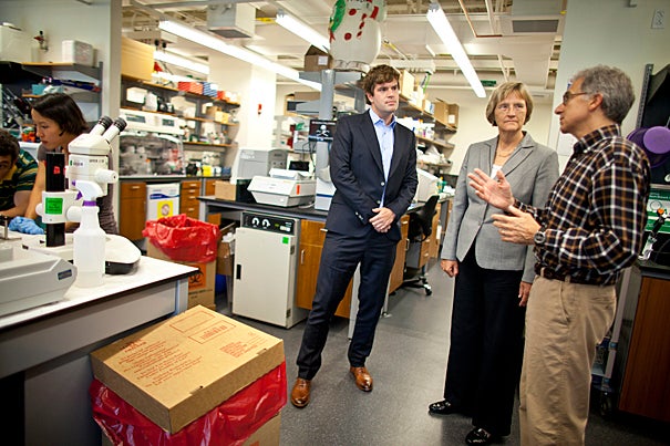 Harvard University President Drew Faust (center) visits with Doug Melton (right), co-director of the Harvard Stem Cell Institute, and Kevin Eggan (left), associate professor of stem cell and regenerative biology.