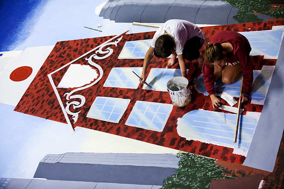 Ginny Fahs '14 (left) and Megan McDonnell '14 paint some Harvard against the Boston skyline. Stephanie Mitchell/Harvard Staff Photographer