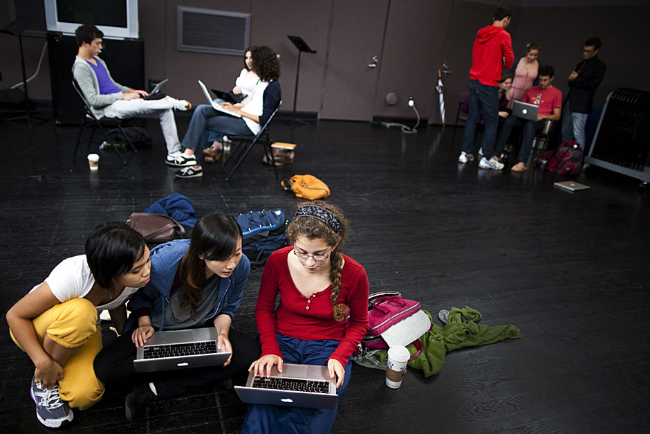 Script writers Riana Balahadia '14 (from left), Xiaoxiao Wu '14, and Georgia Shelton '14 bounce around ideas in a room filled with brainstorming writers. Stephanie Mitchell/Harvard Staff Photographer