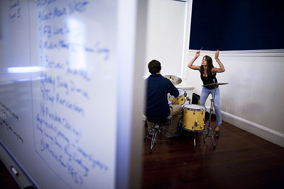 Behind the dry erase board, Aviva Hakanoglu '14 (right) conjures magic in a drum rehearsal for the pageant. Stephanie Mitchell/Harvard Staff Photographer
