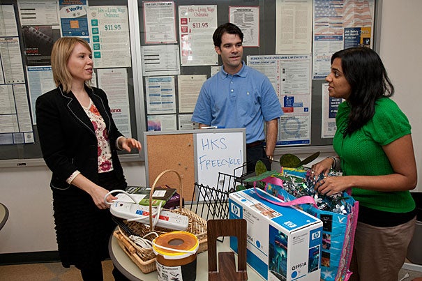 “Our goal is to get all the HKS administrative offices Leaf 1-certified by the end of the year,” said Vidya Sivan (right), with HKS staffers Sidney Besse (left) and Neal Doyle. The trio are promoting "freecycling" — the giving away of items, instead of wasting them.