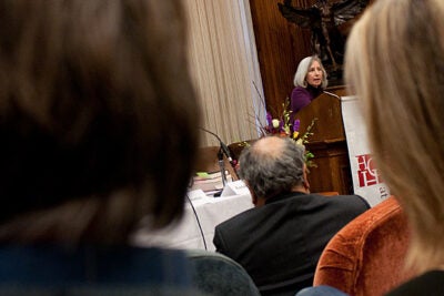 Harvard Law School Dean Martha Minow (at podium) said she set out to write a book that acknowledged the limitations but celebrated the achievements of the 1954 Supreme Court decision Brown v. Board of Education of Topeka. The result was “In Brown’s Wake: Legacies of America’s Educational Landmark," which was the cornerstone of a two-panel discussion at Harvard on Dec. 4.