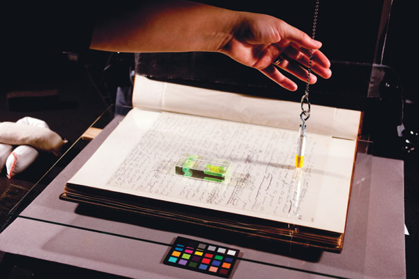 Imaging technician Lily Brooks breathes new life into a Theodore Roosevelt manuscript inside Widener Library's digital lab.