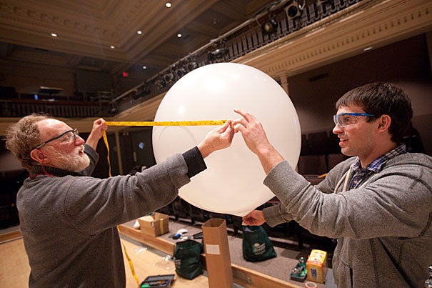 Barry Griffin (left), a visiting lecturer on design and design curriculum development, led a group undergrads on a winter break project to invent and construct a balloon-supported structure that could be used for lifting and/or shelter in the wake of disasters like last year's earthquake in Haiti. Here, the prototypes are built in Lowell Lecture Hall.
