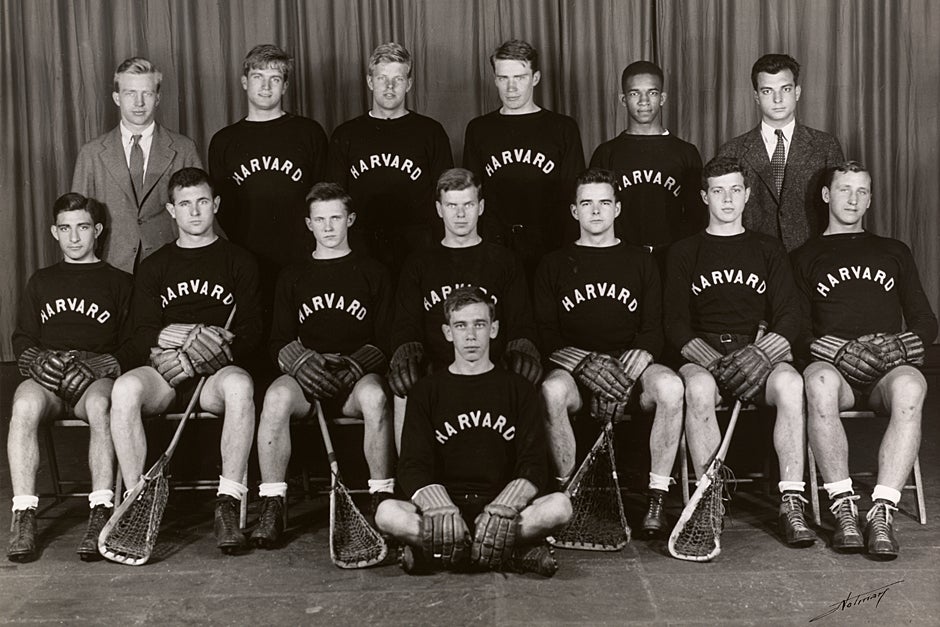 This Harvard Varsity Lacrosse Team spring season photograph from 1941 shows Lucien Alexis (top row, second from right) and coach Richard W. Snibbe, M.Arch ’41(top row, left). Alexis’ involvement in the 1941 Harvard Lacrosse Team sparked a debate about segregation that helped contribute to the desegregation of college athletics in the South. Credit: Harvard University Archives, call # UAV 170.270 PF