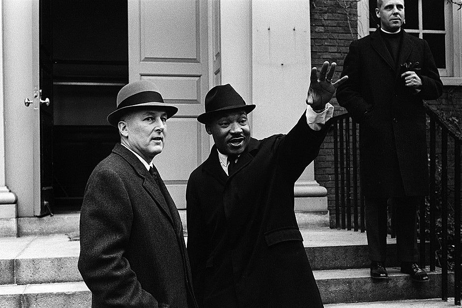 President Nathan Pusey with the Rev. Martin Luther King Jr. on the steps of Appleton Chapel during a Southern Christian Leadership Conference meeting on Jan. 10, 1965. Also pictured is the Rev. Charles P. Price (upper right). Credit: Harvard University Archives, call # UAV 605 Box 86