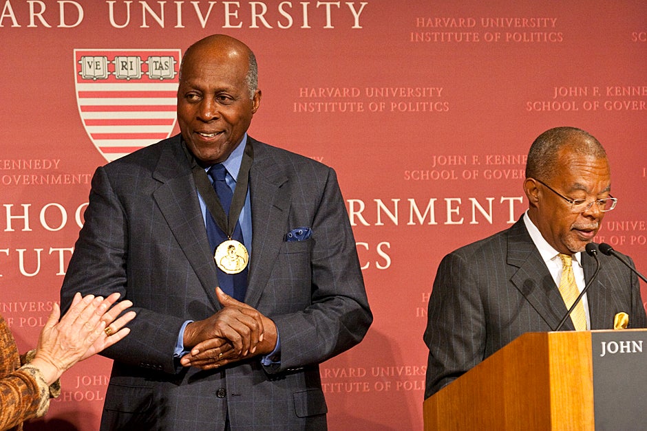Dec. 4, 2009. Vernon E. Jordan Jr. accepts his Du Bois Medal at a ceremony at the Harvard Kennedy School. Henry Louis Gates Jr. (right), Alphonse Fletcher University Professor and director of the W.E.B. Du Bois Institute for African and African American Research at Harvard University, helped present the awards, which are given to individuals whose work has contributed significantly to African and African-American culture. Photo by Jill Foley