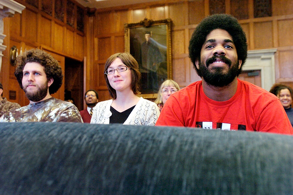 March 19, 2005. Graduate students Cameron Leader-Picone (from left), Julia Faisst, and Sheldon Bond enjoy “Unveiling the Life and Legacy of Harriet Wilson” inside the Barker Center’s Thompson Room. Wilson was thought to have disappeared from the historical record not long after her novel was published, but scholarly research reveals that she lived for almost 40 more years. Photo by Kris Snibbe/Harvard Staff Photographer