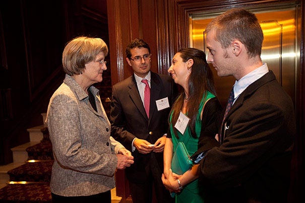 Harvard President Drew Faust (from left) talks with Rodrigo Ravilet, M.B.A. '03, Diana Huidobro, 2006 Extension School alum, and Matias Rivera, Harvard College alum, during a reception before the Harvard Club of Chile Dinner in Santiago, Chile. Photo by Kris Snibbe/Harvard Staff Photographer