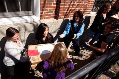 Harvard staff pitched in to help load the mail truck with letters of admission. The letters were mailed out today (March 30) to 2,158 students, 6.2 percent of the record pool of 34,950 applicants. More than 60 percent of the admitted students will receive need-based scholarships averaging more than $40,000, benefiting from a record $160 million in financial aid. 