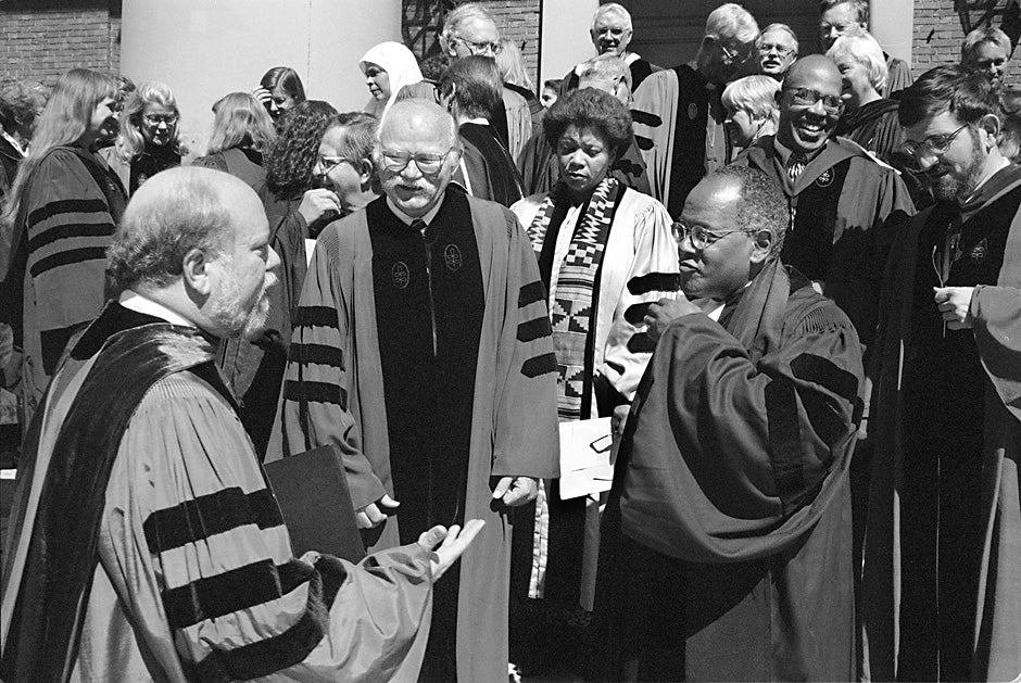 Ronald F. Thiemann (from left), Harvard Divinity School dean and John Lord O'Brian Professor of  Divinity, speaks with Ralph B. Potter Jr., professor of social ethics, and Peter J. Gomes, Plummer Professor of Christian Morals and Pusey Minister in the Memorial Church, at the Divinity School's 181st convocation in 1997. Kris Snibbe/Harvard Staff Photographer 