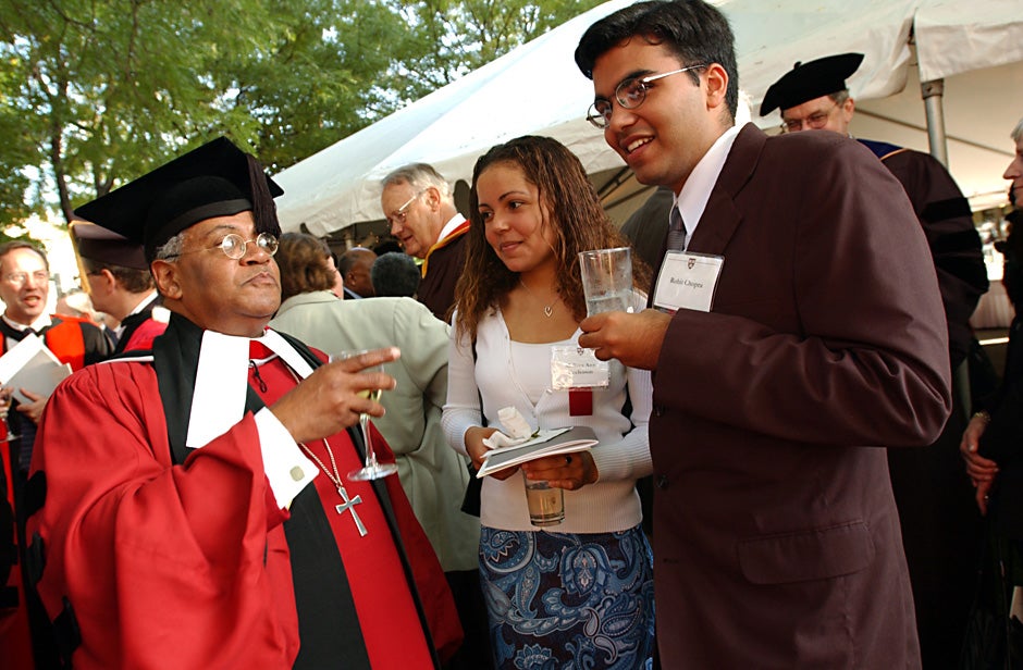 Rev. Peter J. Gomes (from left), Melissa Ann Eccleton, and Rohit Chopra chat during a party at Loeb House following the inauguration of Lawrence H. Summers as Harvard University president in 2001. Stephanie Mitchell/Harvard Staff Photographer