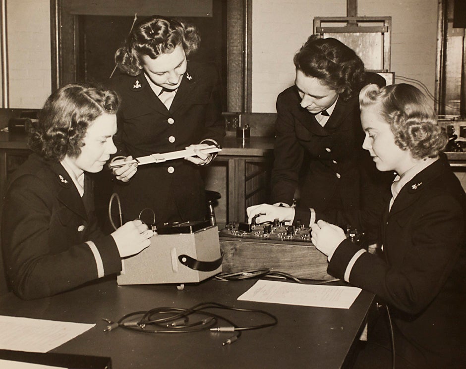 Harvard University Archives image. Inscription reads, "Navy, L to R, Ensigns E. Schwerin, Norma Meyer, Olga Quadland, and Edith Paulsen, Engineering 263-5 Course at Pierce Hall, October 23, 1943." Stephanie Mitchell/Harvard Staff Photographer