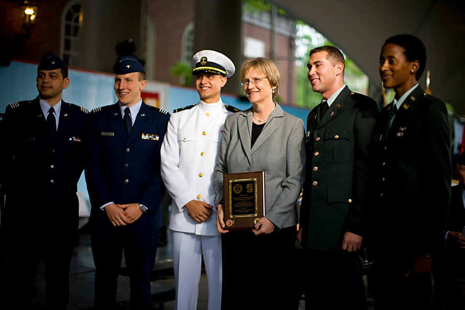 At the 2008 ROTC commissioning ceremony, Harvard President Drew Faust (center) poses with Reserve Officers' Training Corps members U.S. Air Force 2nd Lt. Roberto A. Guerra (from left) and 2nd Lt. Michael J. Arth; U.S. Navy Ensign John D. Reed; and U.S. Army 2nd Lt. Jason M. Scherer and 2nd Lt. J. Danielle Williams. Justin Ide/Harvard Staff Photographer