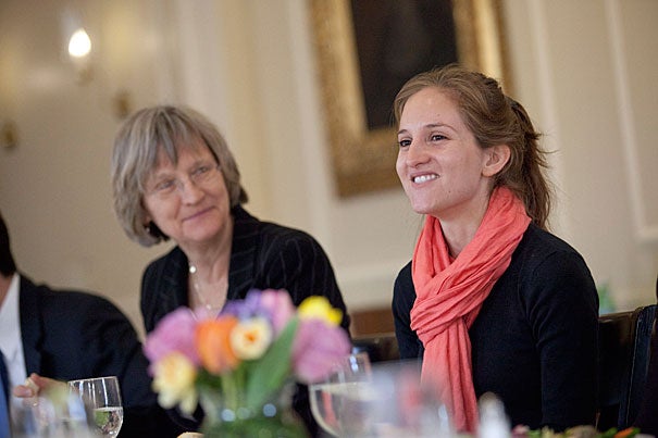 President Drew Faust (left) listens as Dominique Gomez, a Harvard Kennedy School student, discusses public service. Gomez was awarded a grant from the Presidential Public Service Fellowship Program. More than 100 students from across the University applied for the program’s 10 spots.